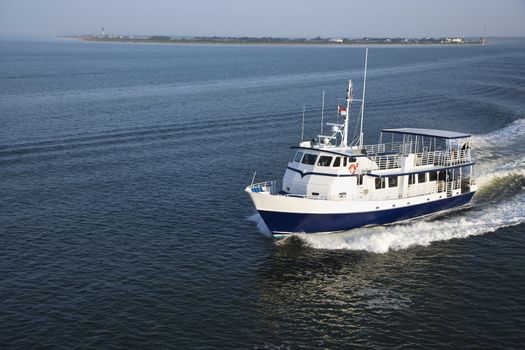 Ferry boat transporting passengers across Atlantic Ocean near Bald Head Island, North Carolina.