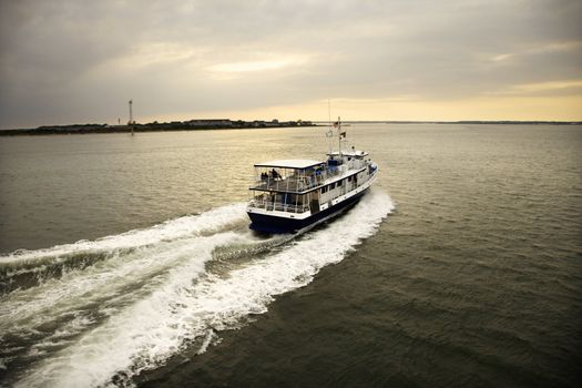 Ferry boat transporting passengers across Atlantic Ocean near Bald Head Island, North Carolina.