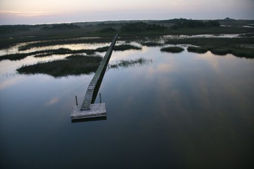 Aerial view of boat dock and walkway over marsh at Bald Head Island, North Carolina.