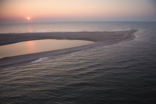 Scenic aerial view of sandbar at Baldhead Island, North Carolina at dusk.