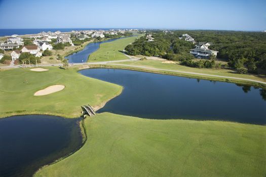 Aerial view of golf course in coastal residential community at Bald Head Island, North Carolina.