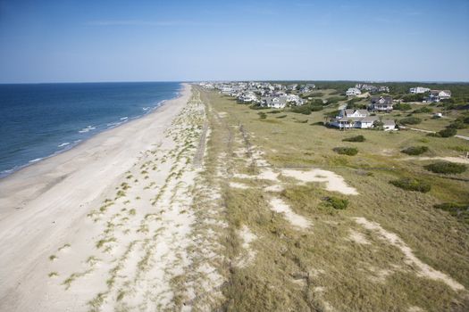 Aerial view of beach and residential neighborhood at Bald Head Island, North Carolina.