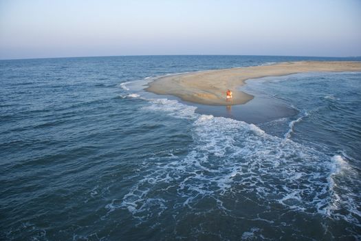 Birds eye view of couple on sandbar in Bald Head Island, North Carolina.