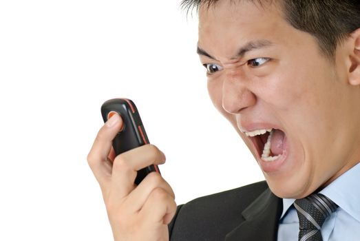 Business man yell to phone, closeup portrait of Asian with angry expression on face against on white background.