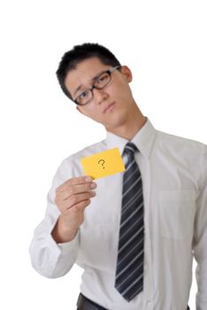 Confused business man with question pattern on yellow card, closeup portrait focus on card against on white background.