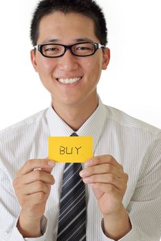 Shopping business man holding card written buy words and smiling.