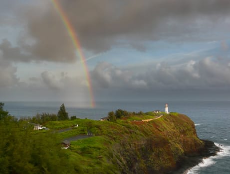 Nice rainbow over Kilauea lighthouse at the north shore of Kauai, Hawaii, in the early morning.