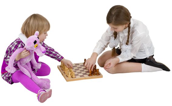 Children play chess on the white background