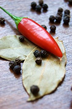 Red cayenne and black pepper with bay leaves
