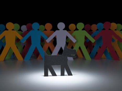 A black paper dog stands under the spotlight in front of a multicolor crew.