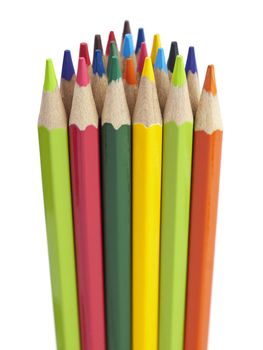 Several colored pencils stand together forming a triangle shape.