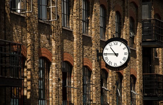 A wall clock outside a market hall in England