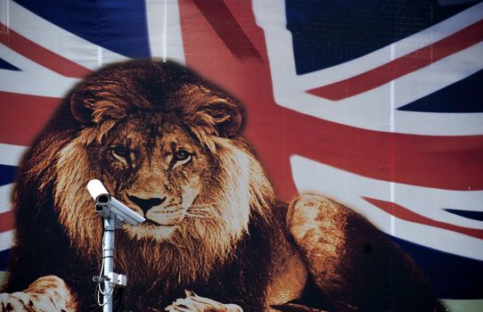CCTV cameras in front of a wall poster depicting a lion and the flag of England