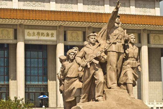 Under the blue and white sculpture in front of Chairman Mao Memorial Hall