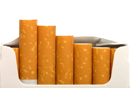 Open a pack of filtered cigarettes closeup isolated on a white background.