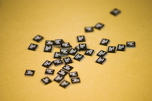 A heap of microchips lying on a table.