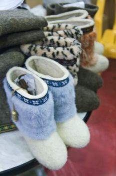 Traditional Russian felted shoes on shelf