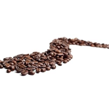 bounch of roasted coffee beans mimic a road shape