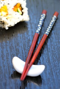 healthy very popular Japanese food sushi with chopsticks