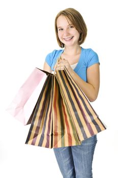 Happy teenage girl with lots of shopping bags