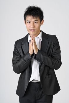 Young business man with peace gesture and smiling.