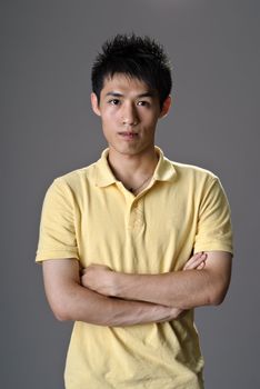 Portrait of young man of Asian, closeup image with confident expression.