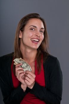 Young Caucasian woman happy after receiving some money