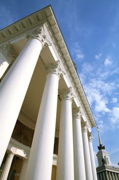 Moscow, Russia, Architecture, History Building with White Pillar on Background Blue Sky