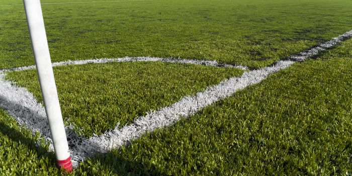 Corner kick in a plastic grass soccer field