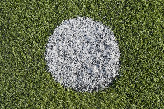 Soccer penalty kick on plastic grass