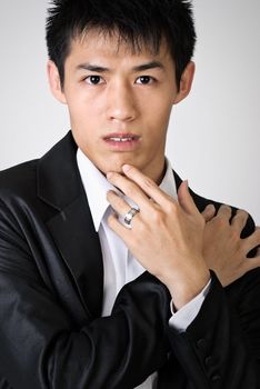 Attractive young business man, closeup portrait of Asian.