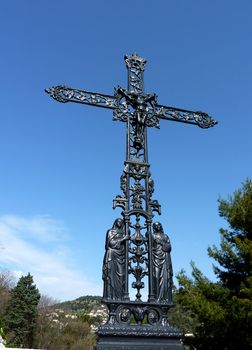 Beautiful black sculptured wayside cross in Eze village, south of France