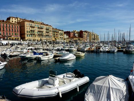 View of the boats and colored buildings at the old port of Nice, France, by beautiful weather