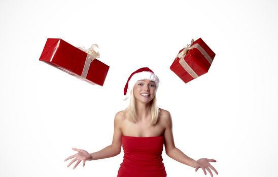 Cheerful Blond Santa Girl Juggling With Presents