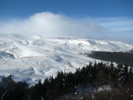 winter; alpine meadow; plateau; wood; snow; relief; nature; landscape; frost; journey; mountain type; sky; background; beauty; Caucasus; spine; panorama