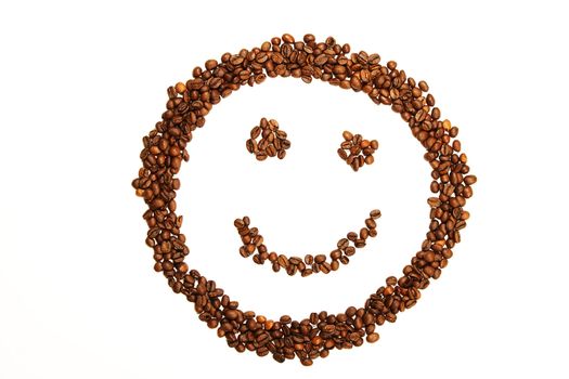 laughing smiley made of coffee beans on white background