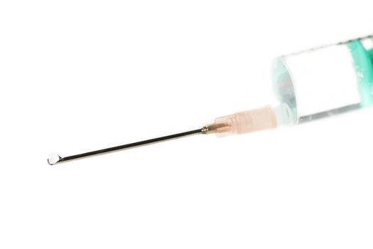 one syringe with a drop on white background