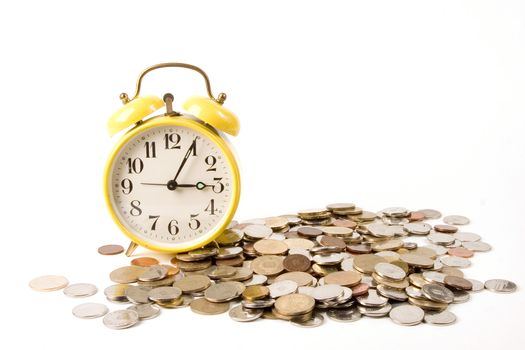 Yellow clock and coins