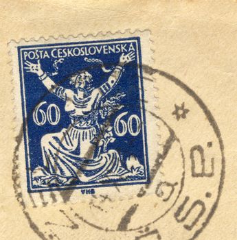 detail of vintage grungy postage stamp on postcard