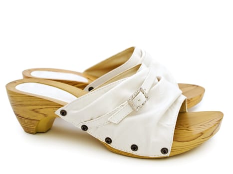 woman's summer white shoes over white background 