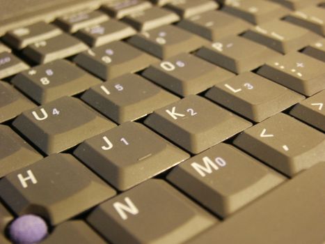 A close up shot of some keys on a laptop keyboard.