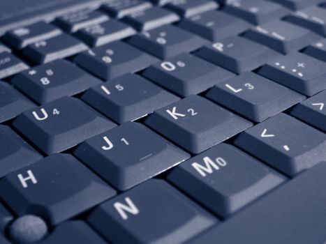 A close up shot of some keys on a laptop keyboard.