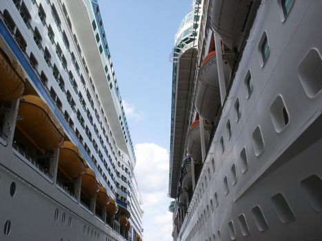 two cruise ships docked across from one another