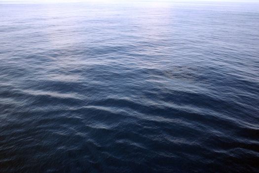 A clear shot of wide open ocean water. Great background picture.