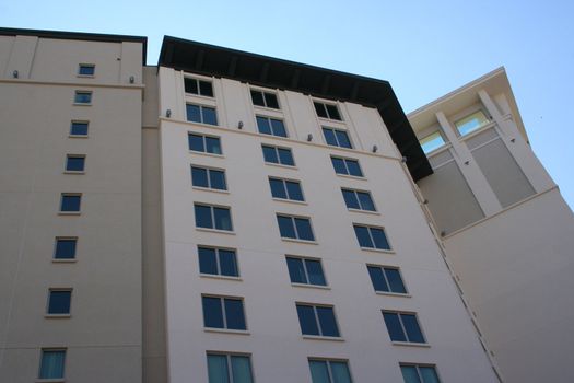 A tall building view from below.  Taken on a nice bright day.  Image has a lot of detail.