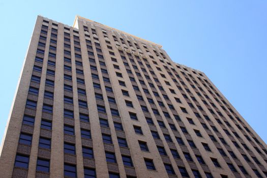 A tall skyscraper view from below.  Taken on a nice bright day.  Image has a lot of detail.