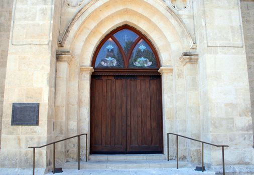 Old wooden doors on a church.