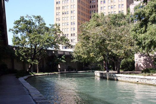 The Riverwalk in San Antonio, Texas on a sunny day.  This attraction is in the heart of downtown San Antonio.