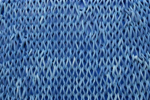 Photo of blue netting as a background.