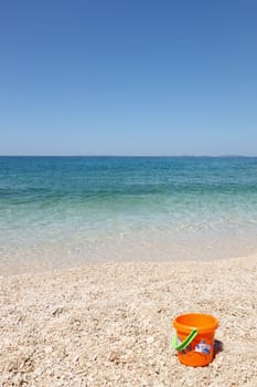 beautiful beach with child's bucket in Croatia